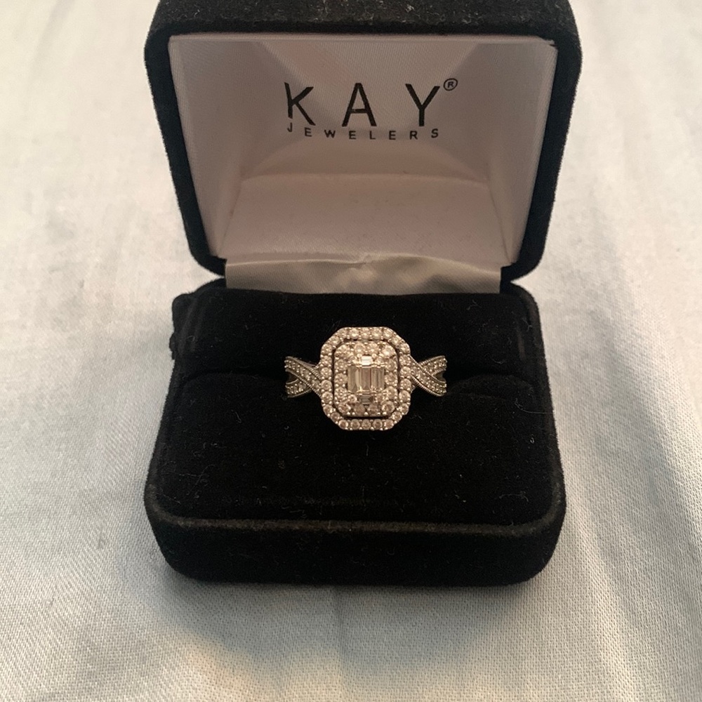 14WG wedding ring size 7.5 but can be resized at Kay jewelry paid 2,161.39